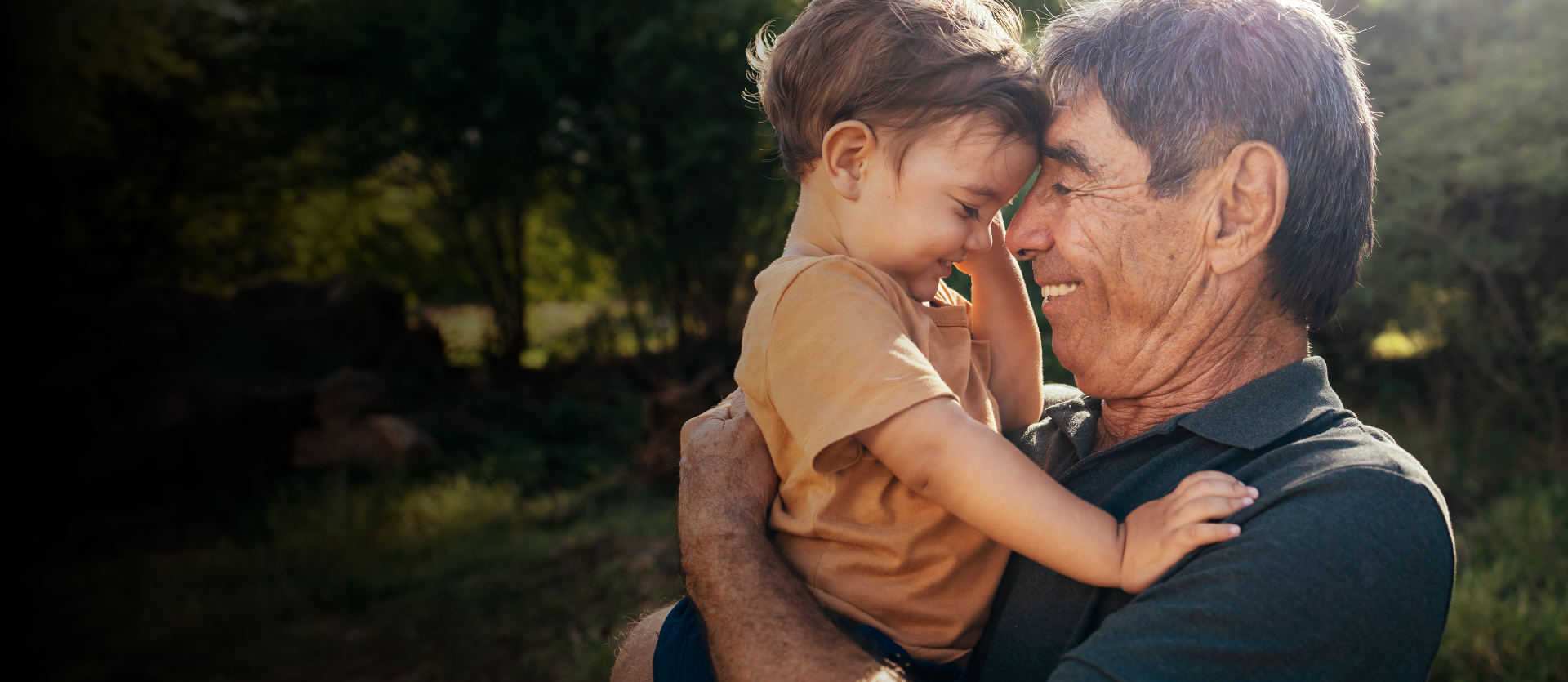 grandfather and grandson hugging