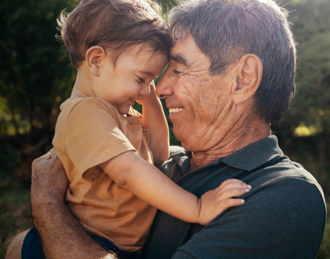 grandfather and grandson hugging