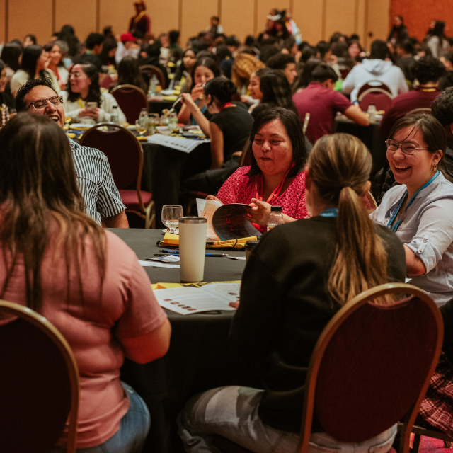 Table with laughing attendees